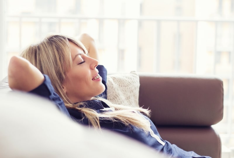 woman relaxing at home on couch
